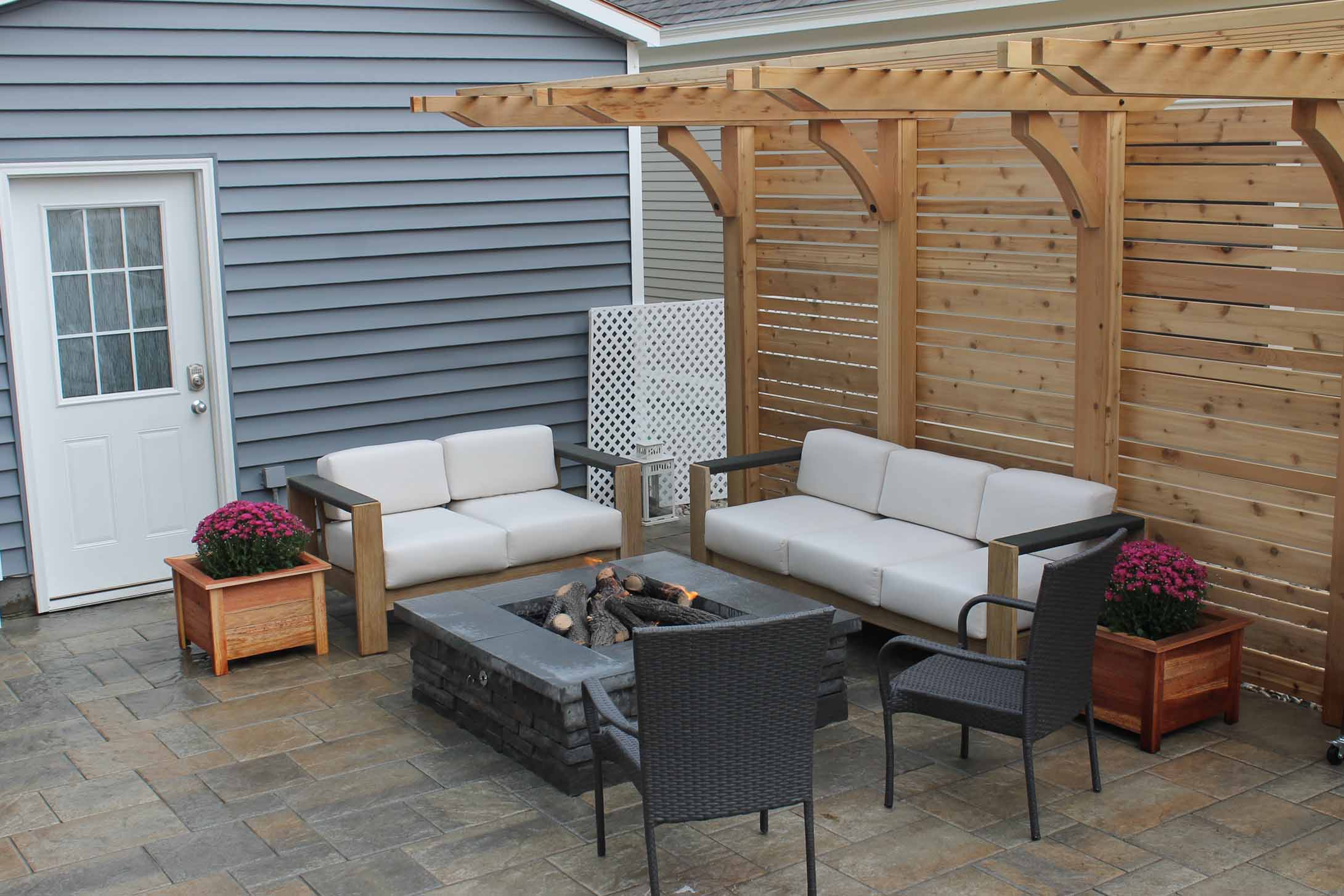 downtown-backyard-remodel-patio-pergola-small-space-firepit-techo-bloc-outdoor-living