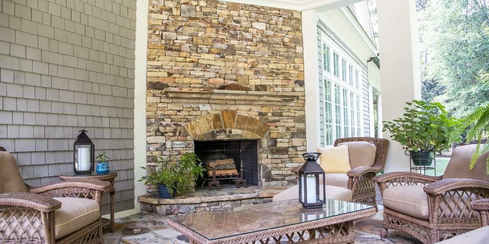 stone fireplace built into side of home