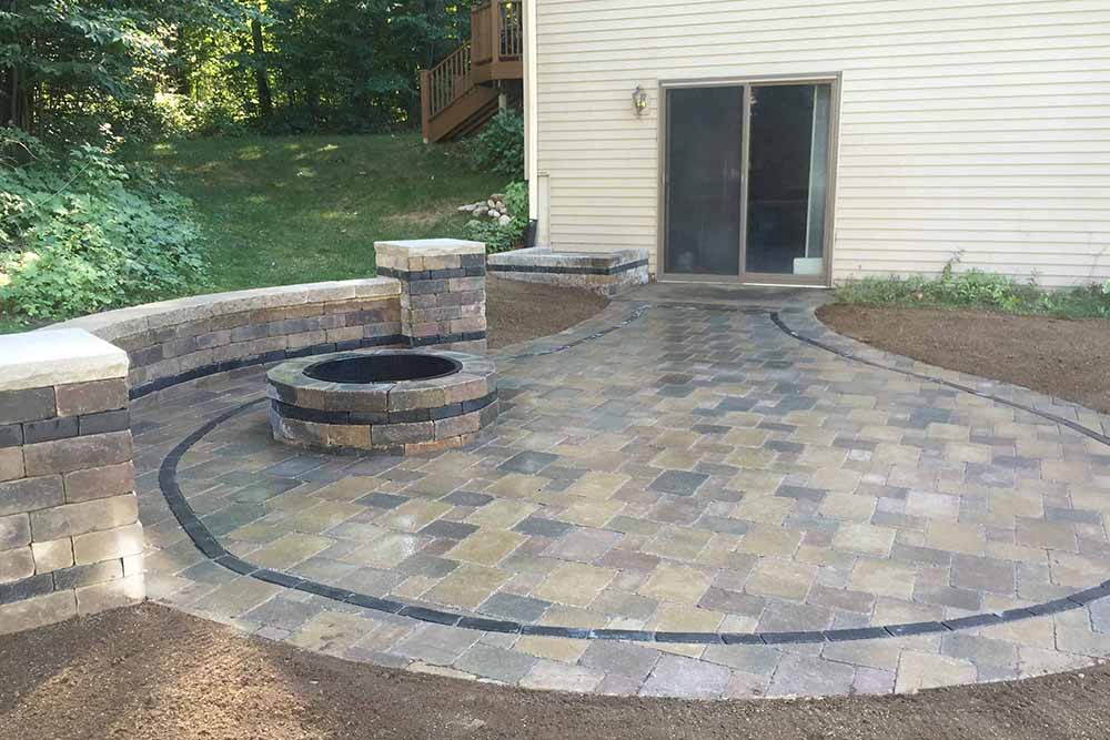 Planning Your Outdoor Living Space Stone Paver Patio Vs Stamped Concrete Trunorth Landscaping - Flagstone Patio Cost Vs Stamped Concrete