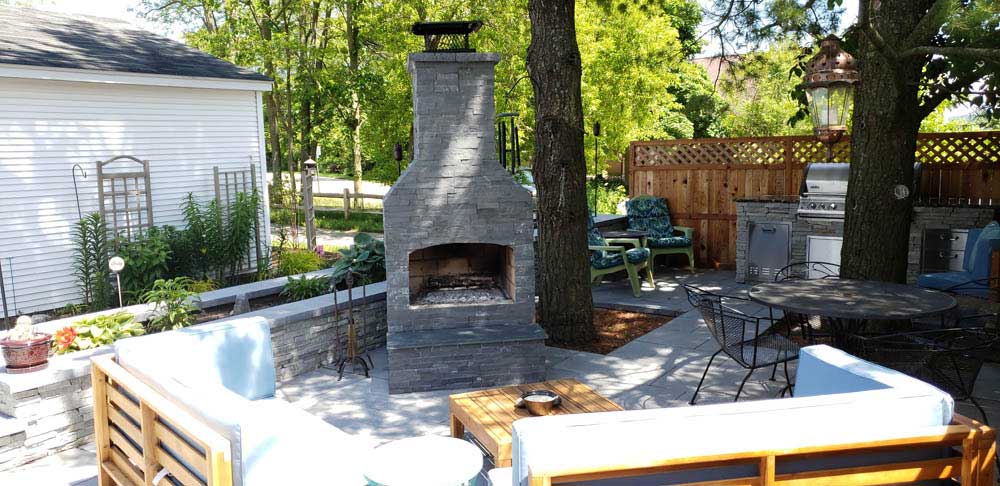 Outdoor Fireplace in Small Downtown Backyard