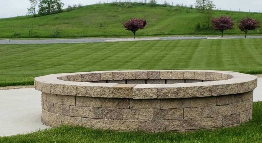 firepit with neatly mowed lawn at commercial property