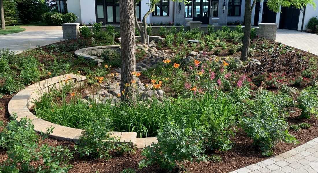 plantings installed in center of circular driveway