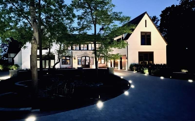 landscape lighting along driveway in front of home