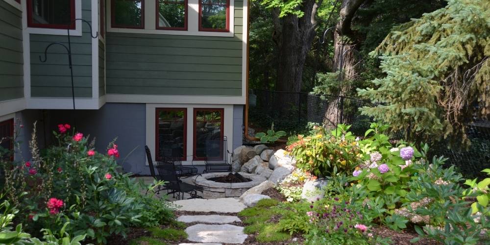 pathway with plantings and small patio and firepit