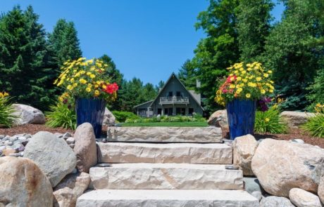 natural stone steps and boulders with container gardens