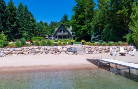 beach with boulder retaining wall and landscape beds