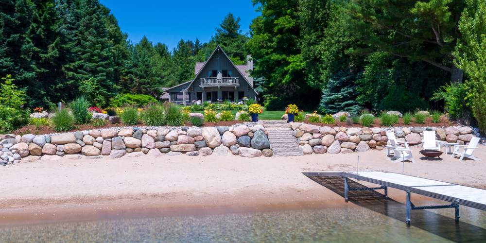 aerial photo of boulder retaining wall and stone steps at beach