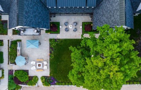 overhead photo of outdoor living space with patio firepit and outdoor kitchen
