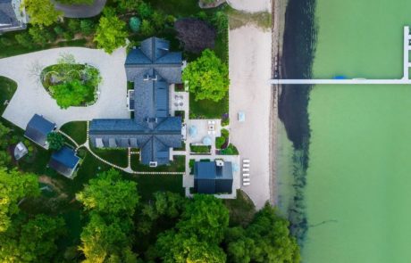 aerial photo of paver driveway outdoor living area and beach