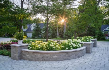 paver drive and retention wall with hydrangeas