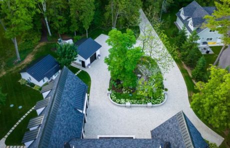 aerial photo of circular paver driveway and plantings