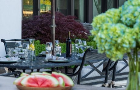 outdoor entertaining area set with watermelon and table setting