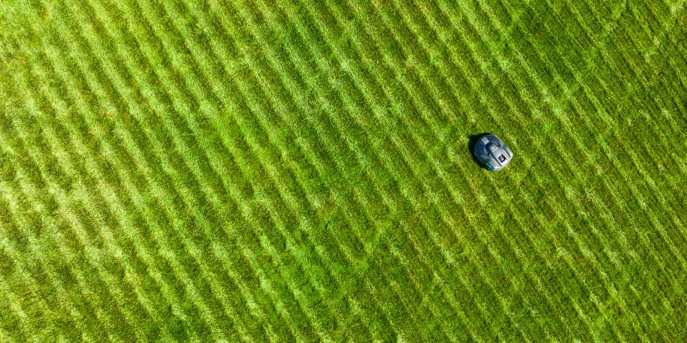aerial photo of robotic mower and grass