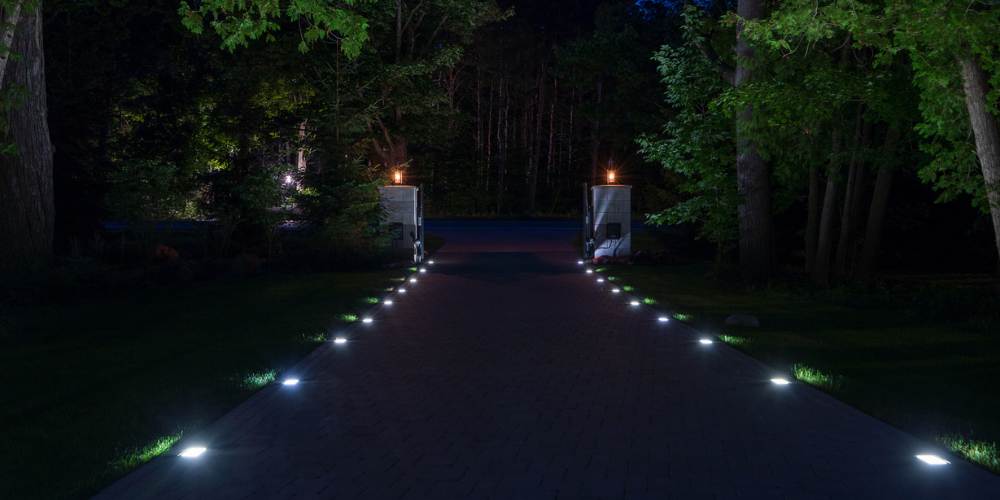 landscape lighting built in to driveway entrance