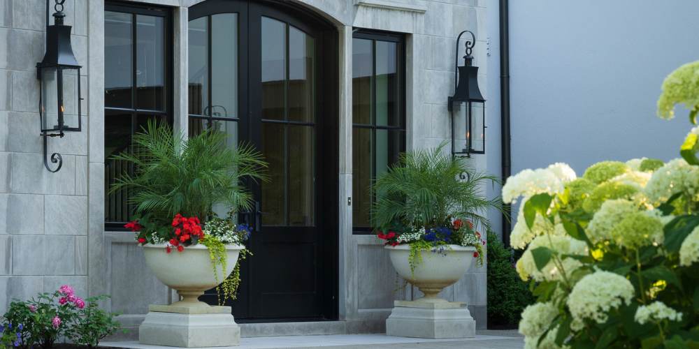 annual flowers in planter near home entrance